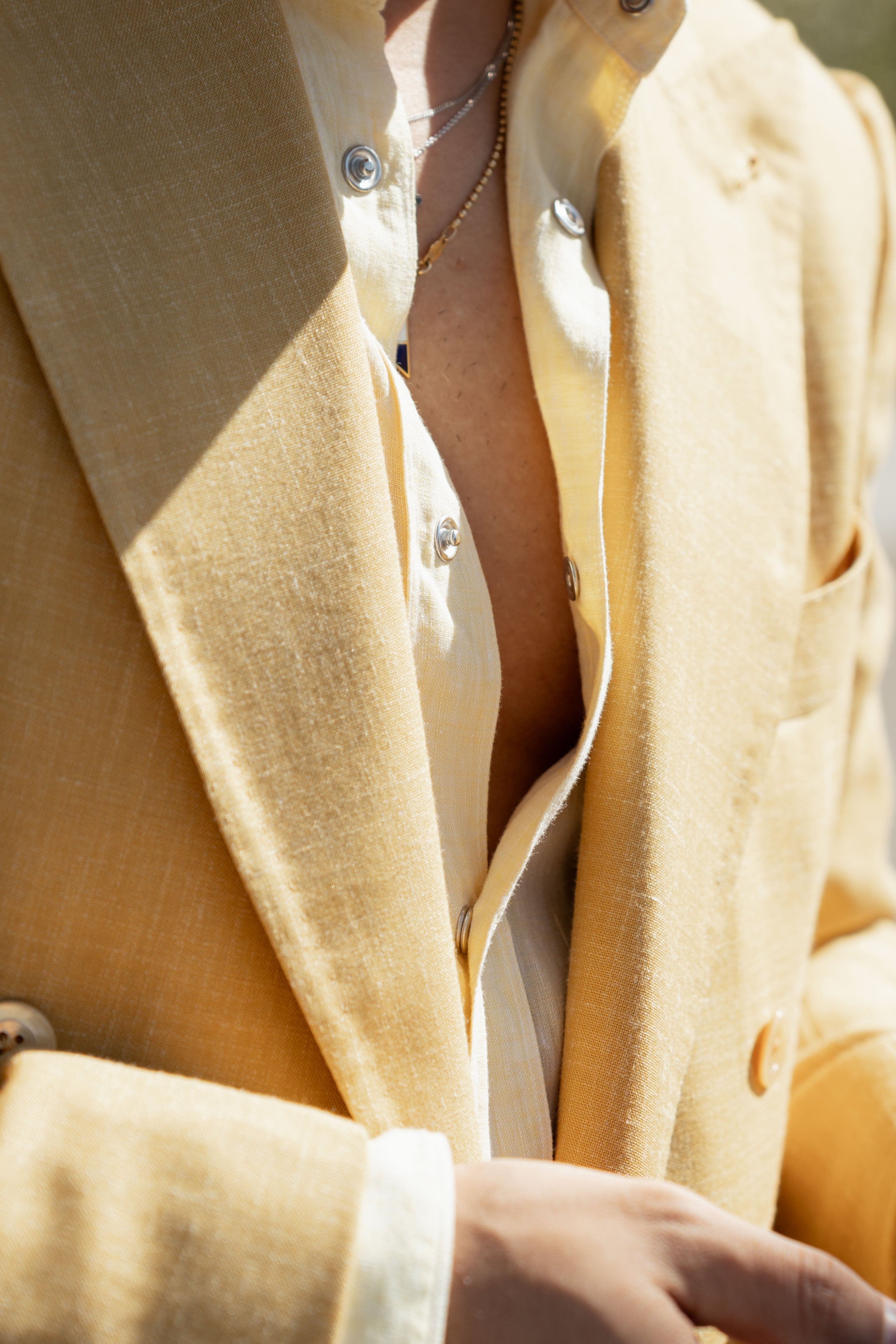 Detail of Niccolo Zaffarano light yellow suit during Pitti Uomo in Italy